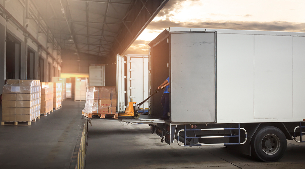 Boxwheel Trailer Leasing provides insight into supply chain issues... - 37 Parked trucks in Dock Warehouse