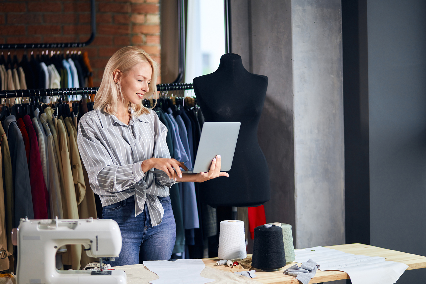 Clothing designer checking inventory