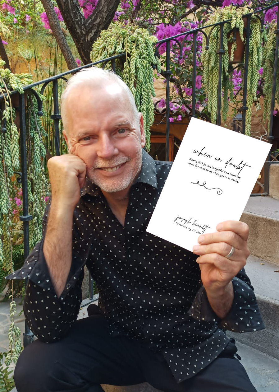 Headshot of Joseph Bennett with his book, When In Doubt