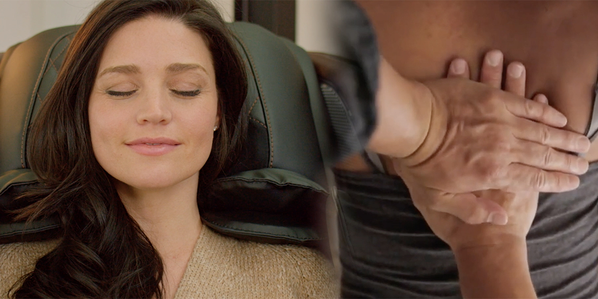 woman in massage chair and massage therapist's hands on back