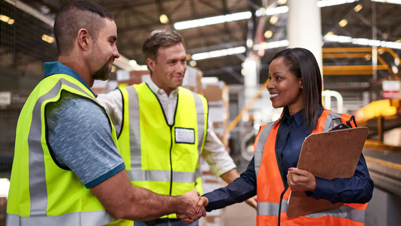 Workers shaking hands
