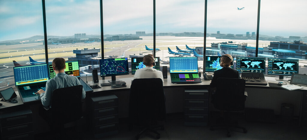 air traffic control team working in a airport tower